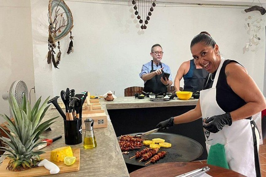 Cooking tacos on a Mexican comal with grilled pineapple. 1