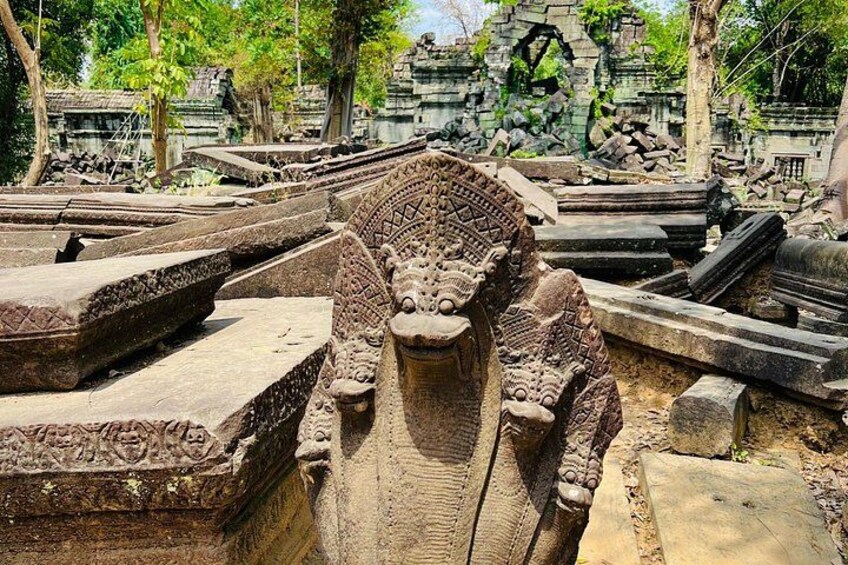 Ancient stone carvings and ruins, including a detailed lion head sculpture. 1