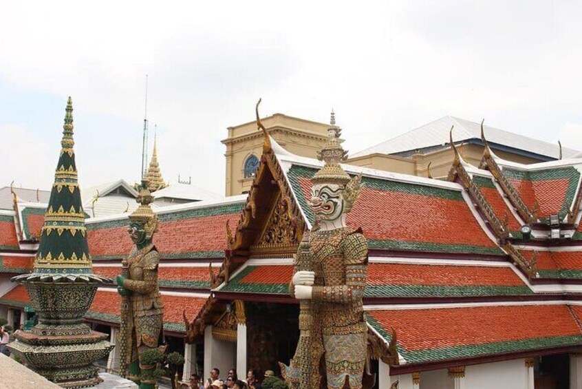 A traditional Thai temple with ornate decorations and tiered roofs. 4