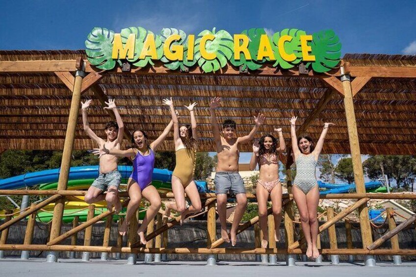 A group of people jumping in front of a sign that reads "MAGIC RACE". 3