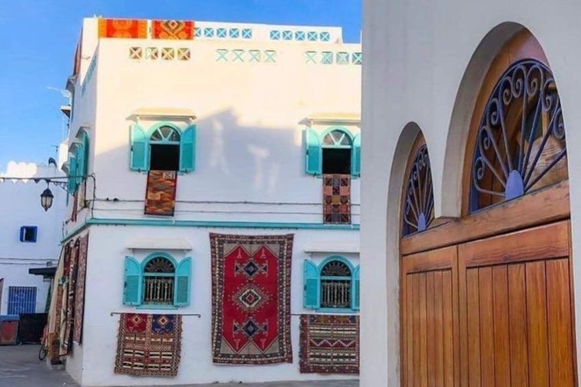 A traditional building with arched windows and decorative patterns. 5