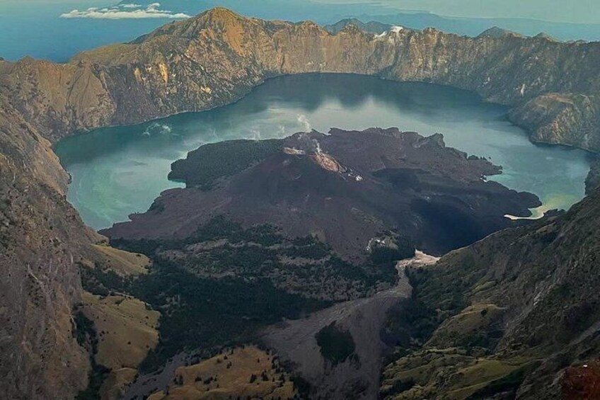 A mountainous landscape with a lake surrounded by rugged terrain. 3