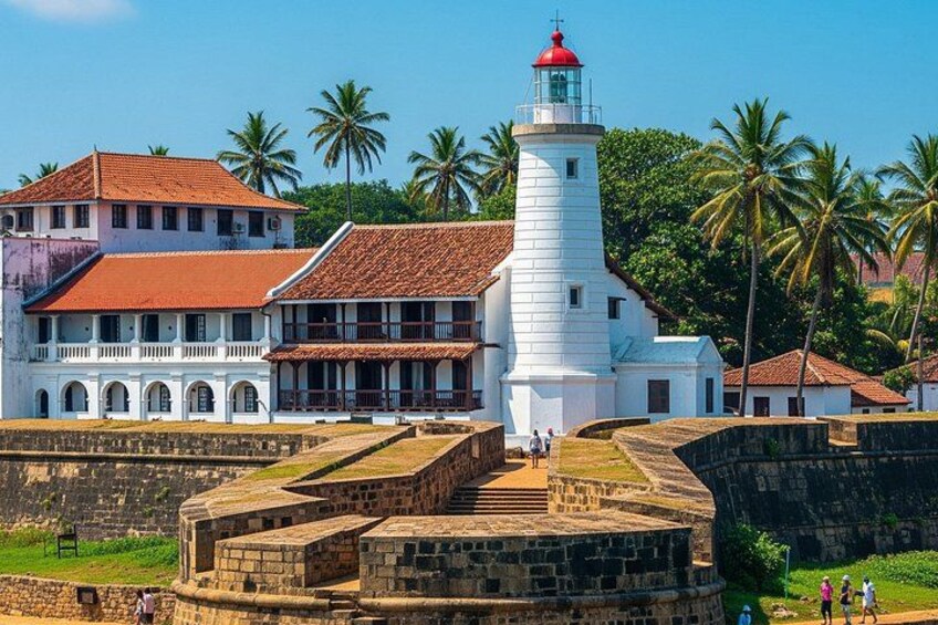 A white lighthouse, a white building with a red roof, and palm trees. 1