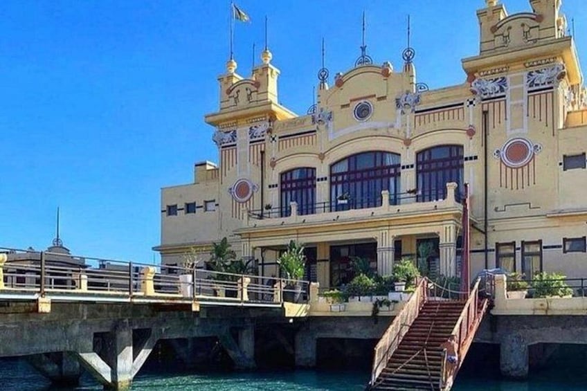 A large, ornate building with a bridge leading to it. 3