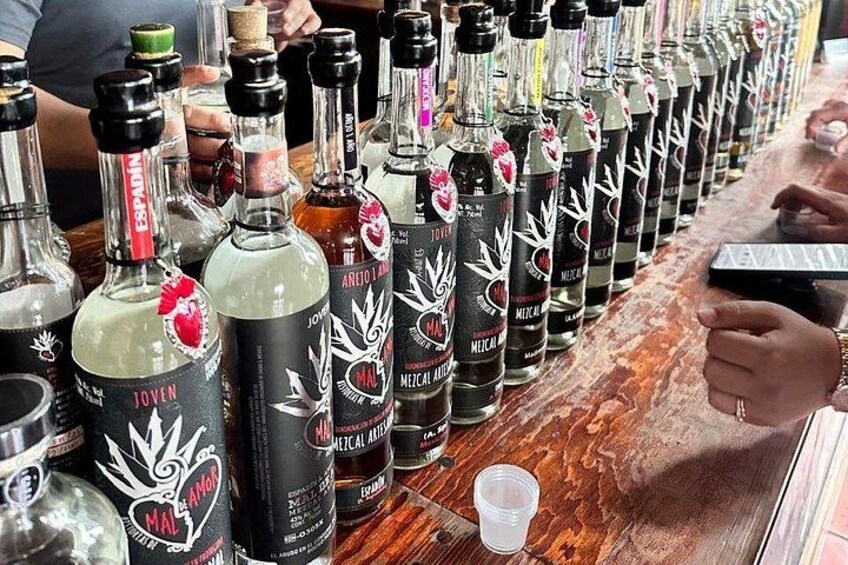 A bar with bottles of tequila and other spirits. 2