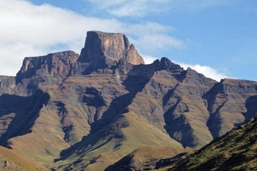 A mountain range with prominent peaks and a clear sky. 5