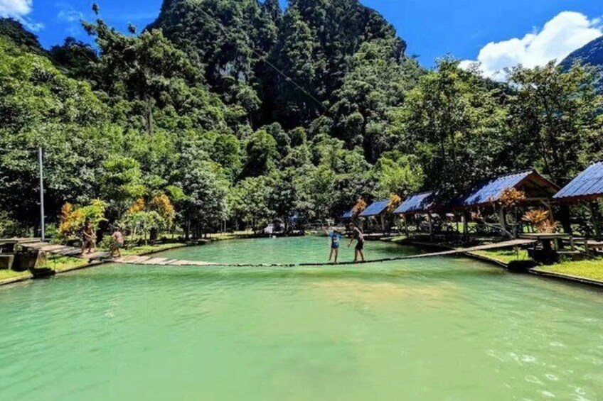 A serene lake surrounded by lush greenery and a mountain backdrop. 2