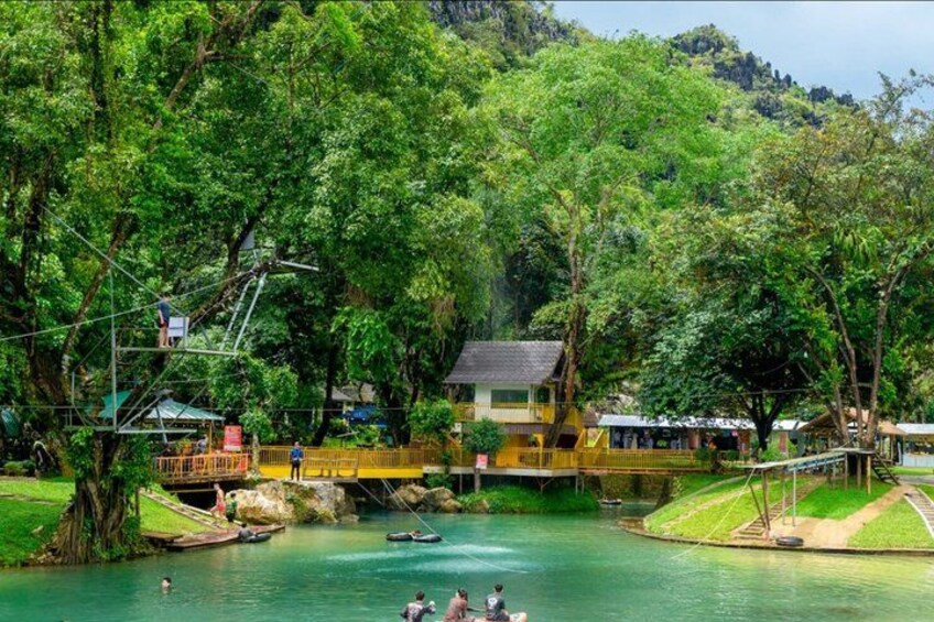 A river with a bridge, a house, and a boat. 5