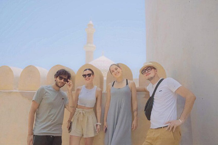 Smiles and sunshine at the iconic Nizwa Fort – where history meets unforgettable moments. 5