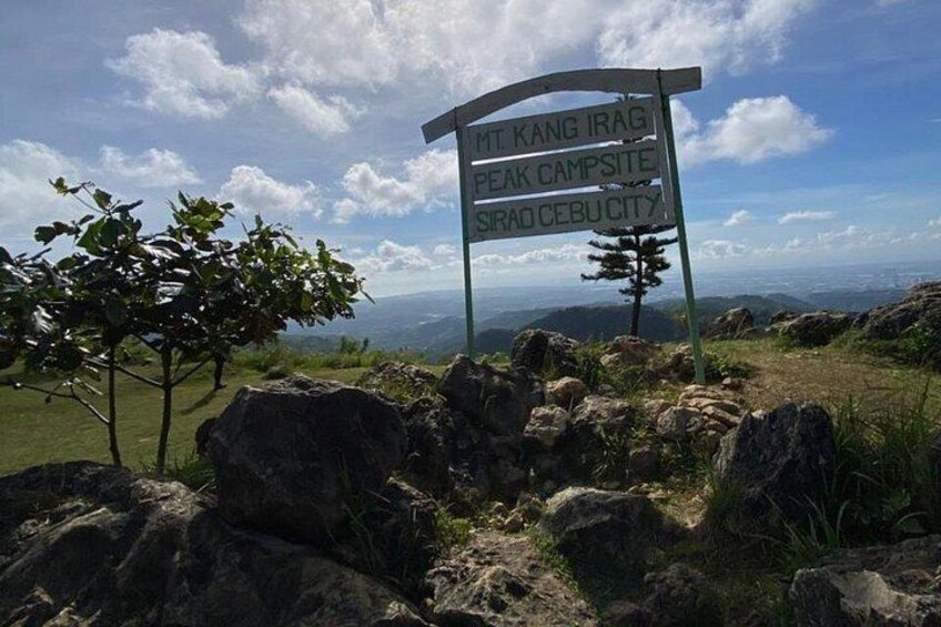 A signpost with directions to Mt. Kang, Peak Campsite, and Sirad Cebu City. 4