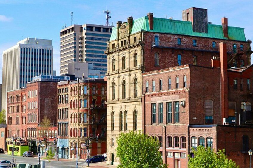 A cityscape with historic buildings and modern skyscrapers. 1