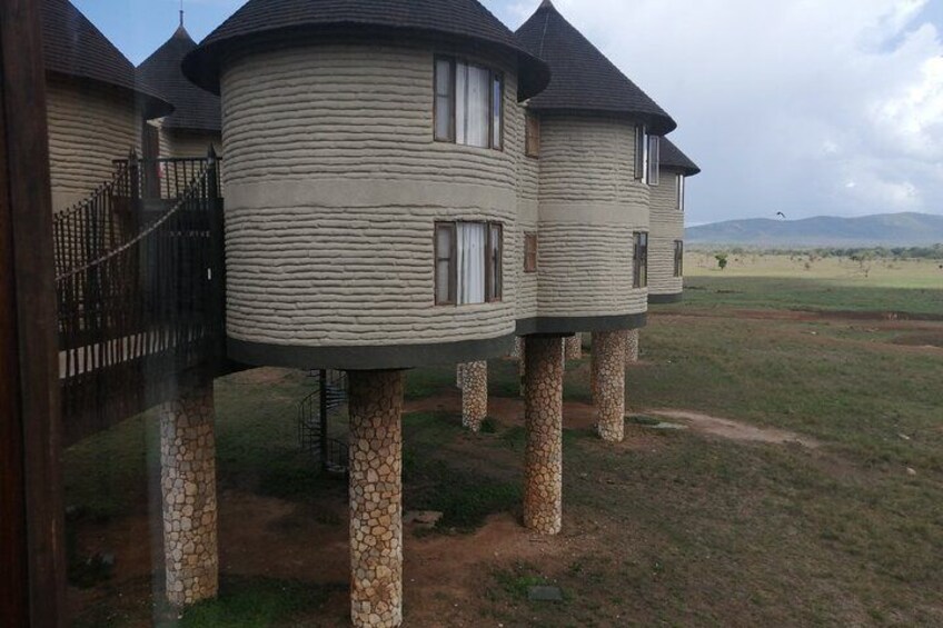 A series of cylindrical houses with stone bases, connected by a bridge. 2