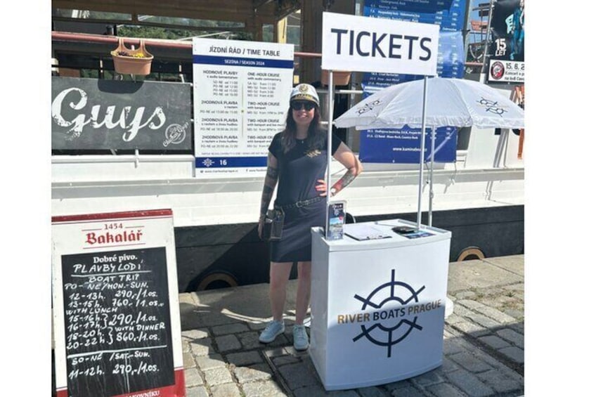 A ticket booth with a sign reading "Tickets" and a menu board for Bahalař restaurant. 2