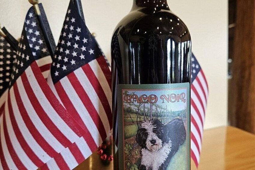 A bottle of wine with a label featuring a dog and American flags. 5