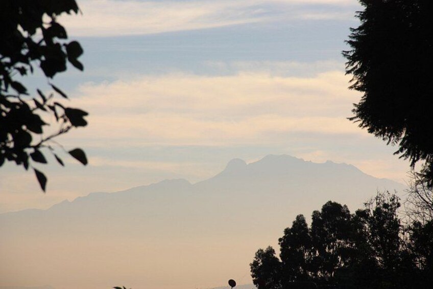 A mountain range with a hazy sky. 1