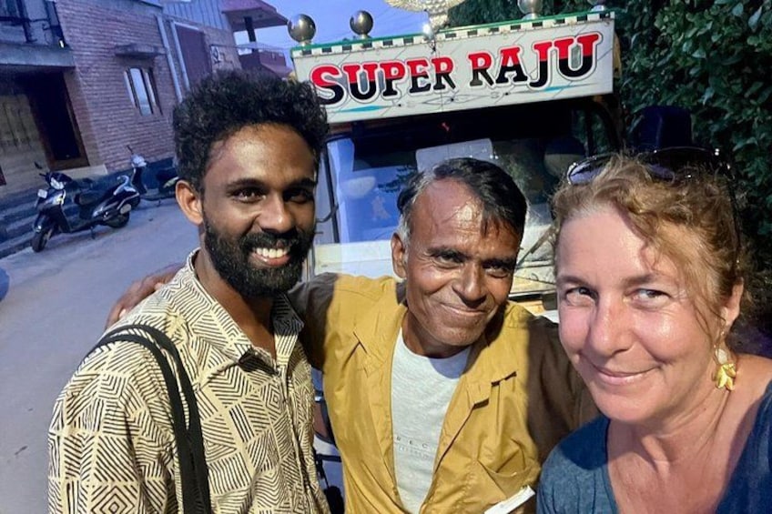 Three people in front of a vehicle with 'SUPER RAJU' written on it. 4