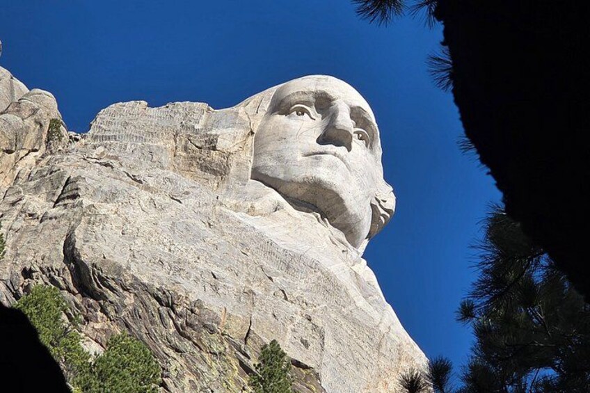 A large mountain with a carved face. 2