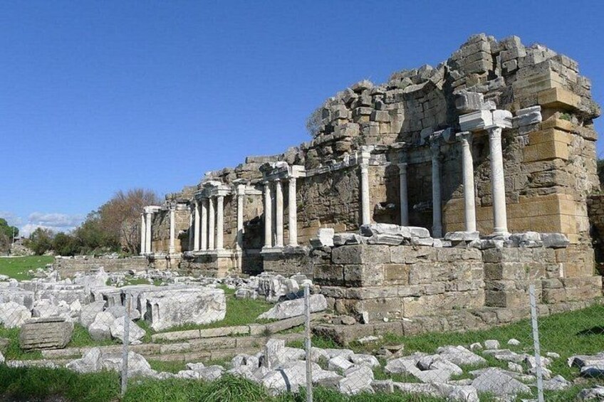 Ancient ruins with columns and stone structures. 3