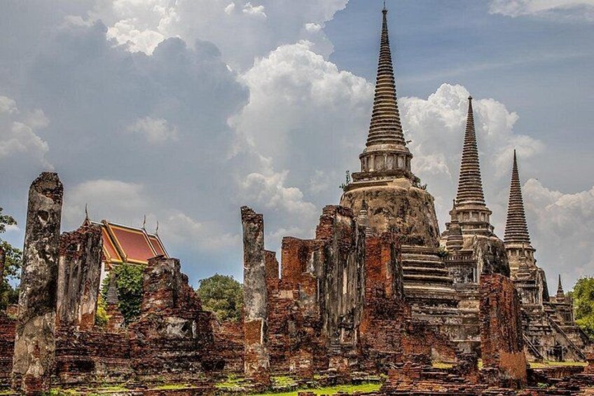 Ancient ruins with multiple structures, including a prominent temple with tiered spires. 3