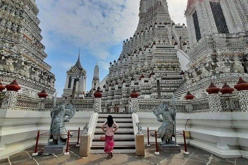 A temple with intricate architecture and a staircase leading up to it. 2