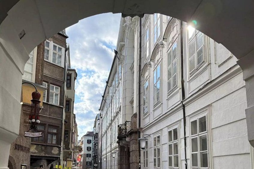 A street view with buildings, a sign, and a clear sky. 4