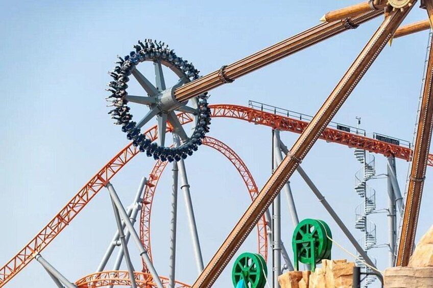 Thrill-seekers experiencing the high-speed twists and loops of this signature ride. 2