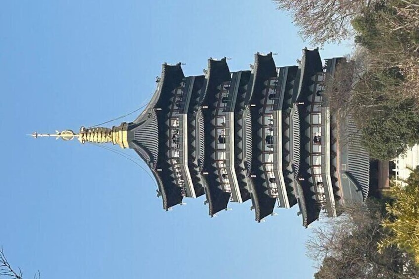 A pagoda with multiple tiers and a pointed spire. 3