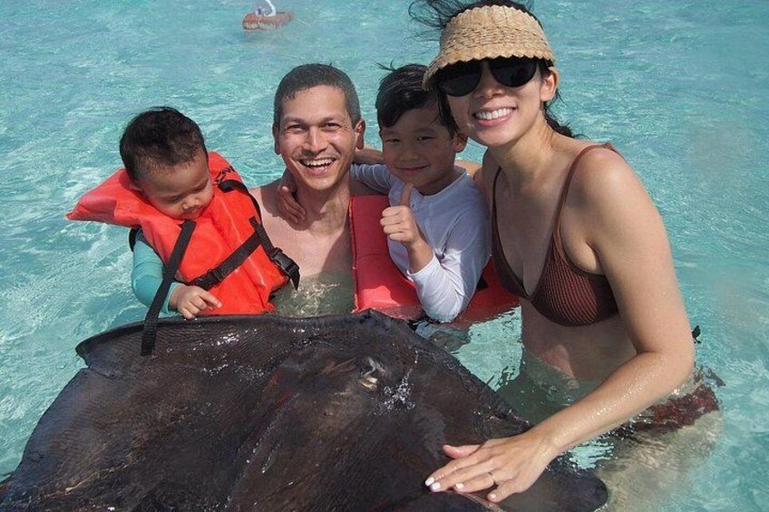Family Interacting with wild Stingray 3
