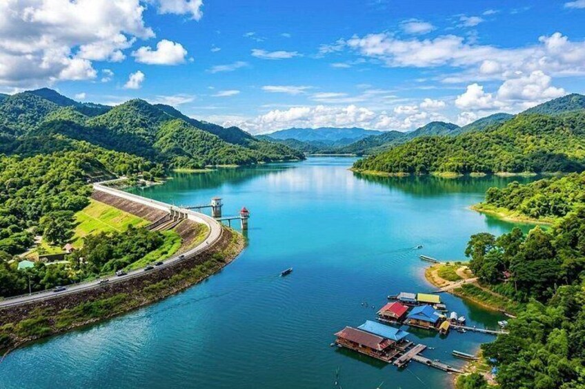 A river with a dam, boats, and a dock. 2