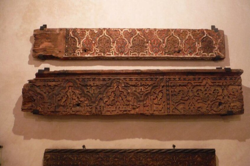 Two intricately carved wooden panels with detailed patterns. 5