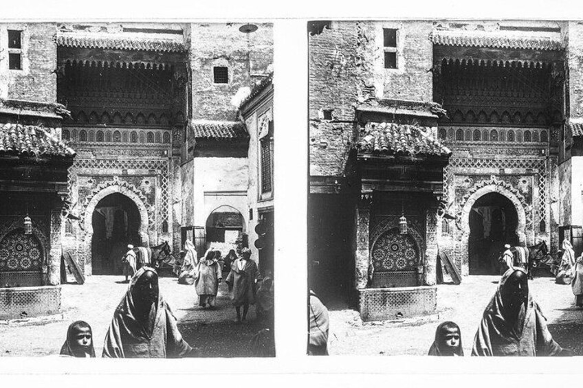 A historical building with intricate arches and detailed brickwork. 3