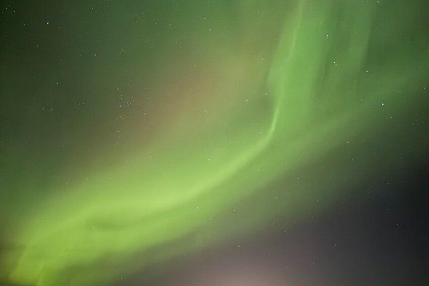 A green aurora in the night sky. 3