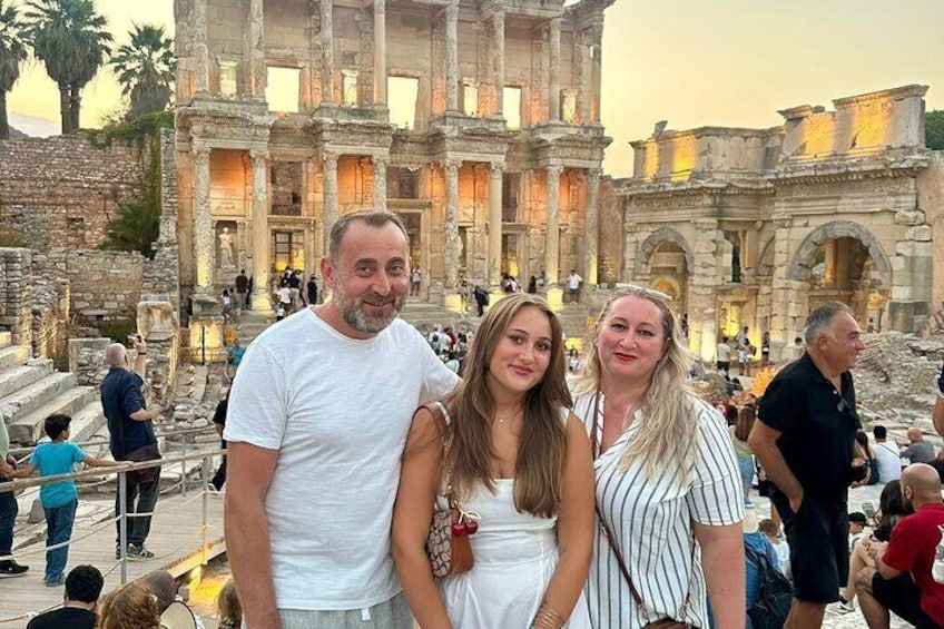 A group of people standing in front of the ancient ruins of the Library of Celsus in Ephesus. 2