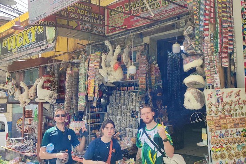 A market stall with various items for sale, including stuffed animals and snacks. 5