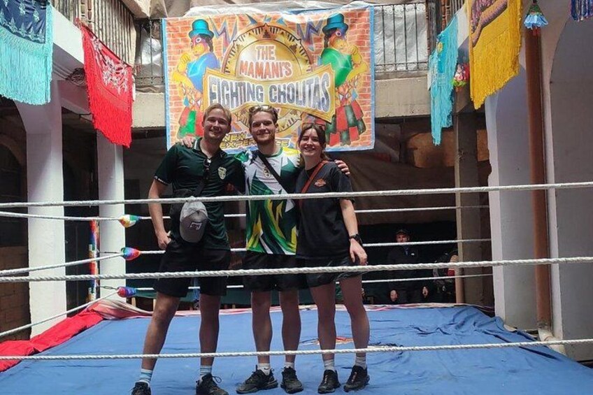 A boxing ring with a banner in the background. 3