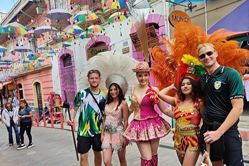 A street with colorful umbrellas and buildings. 1