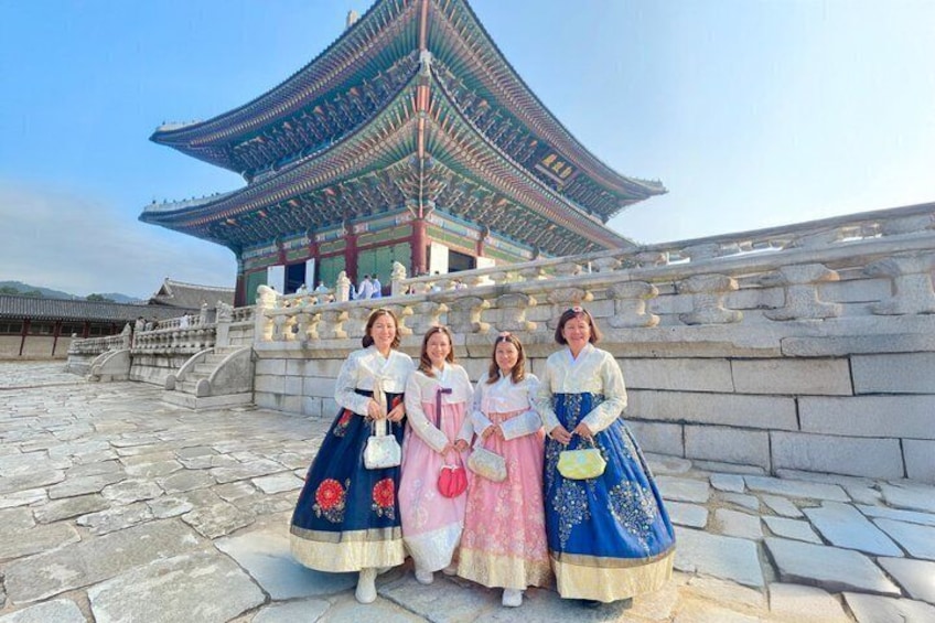 A traditional Korean building with a curved roof and stone steps. 5