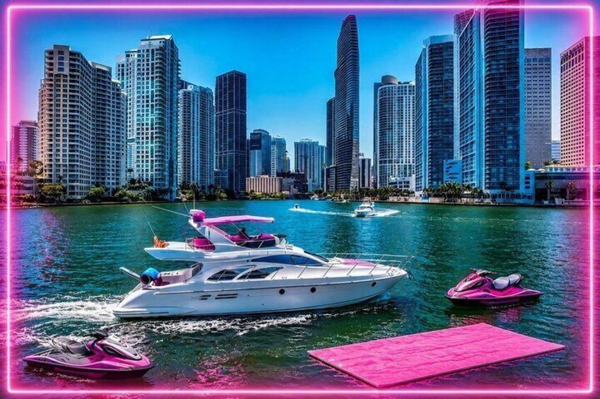 A marina with a yacht, speedboat, and jet ski. 1