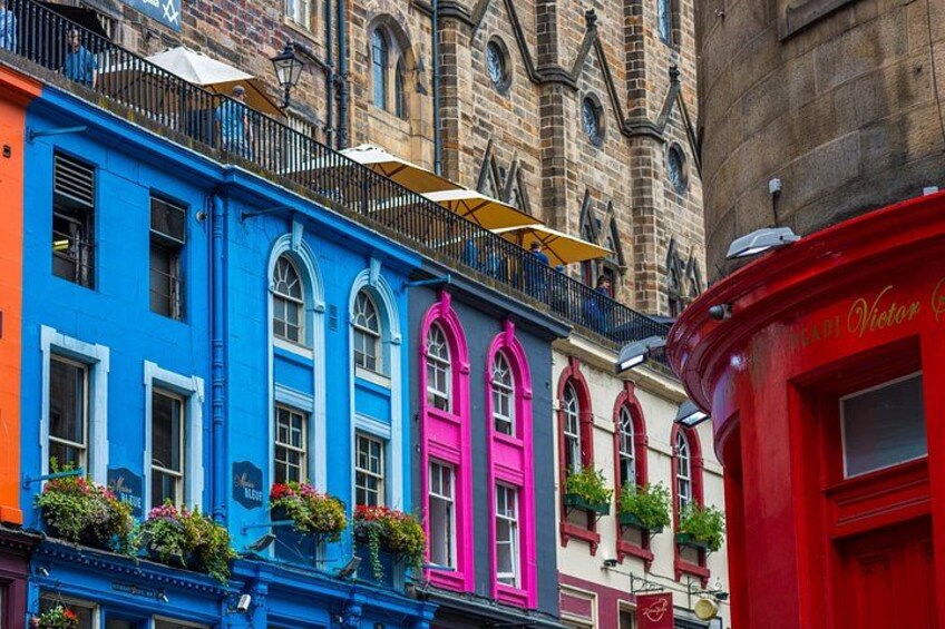 Colorful buildings with balconies and flower boxes. 3