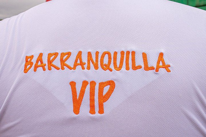 A white fabric with embroidered text 'BARRANQUILLA VIP'. 2