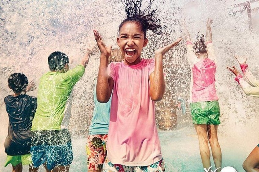 Children playing in a water fountain. 1