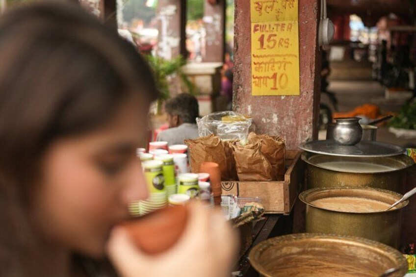 A street food vendor stall with cooking utensils and packaged goods. 3