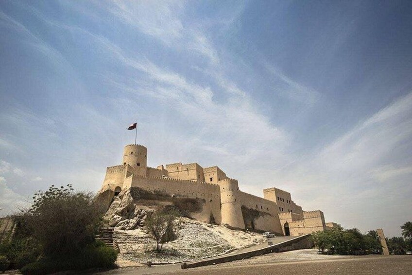 A large, fortified castle with multiple towers and a flag on top. 2