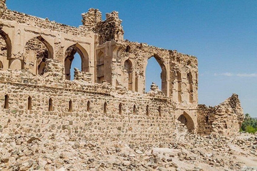 Ancient ruins with arched structures and stone walls. 1