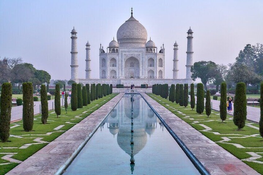 The Taj Mahal with a reflective pool and symmetrical gardens. 5