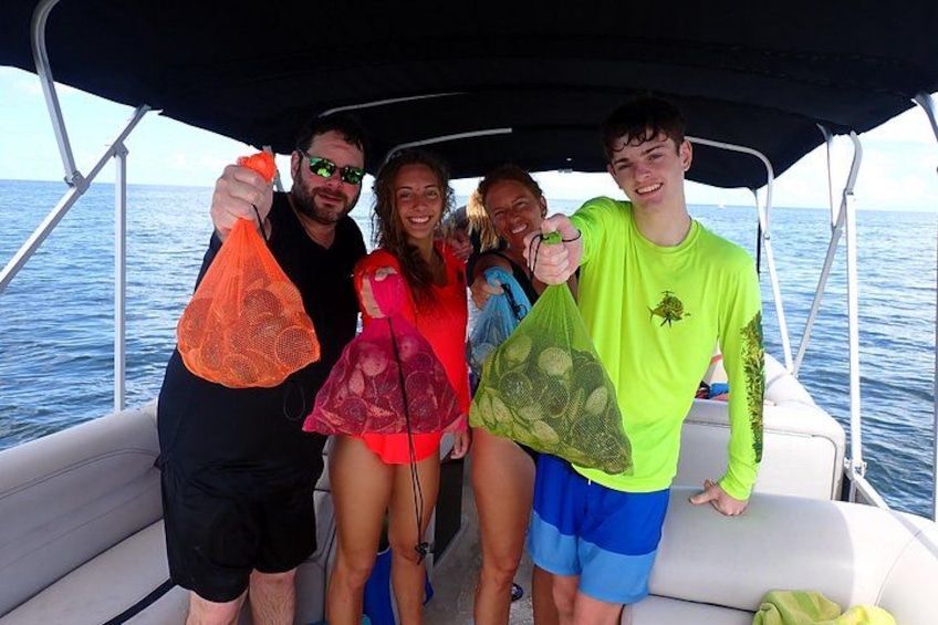 A group of people on a boat with a net bag and a net. 1