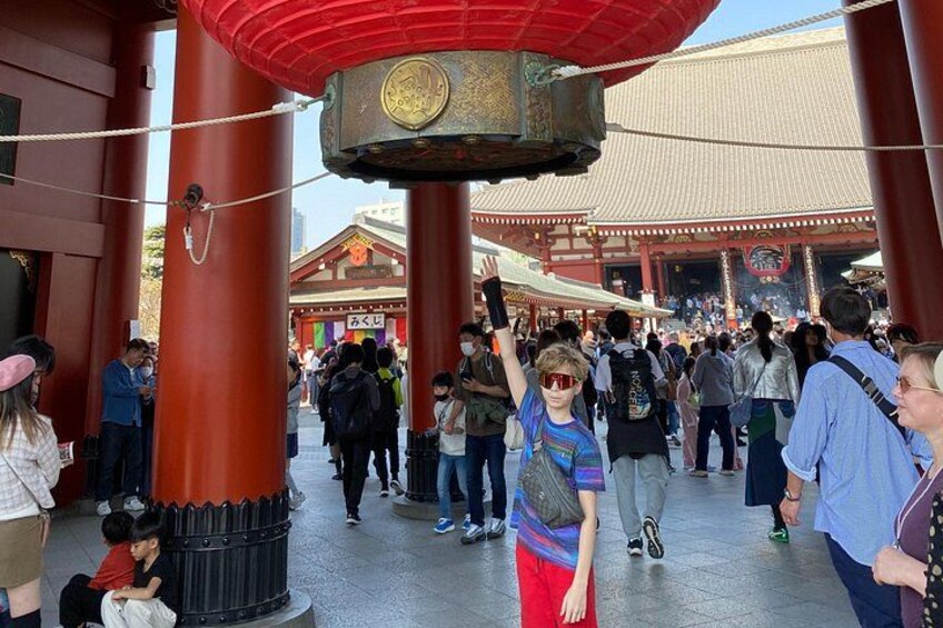 Capture the perfect shot beneath the glowing lanterns of Kaminarimon Gate. 5