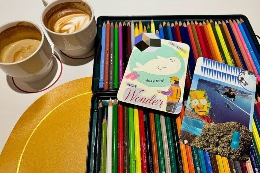 A table with a card game, colored pencils, and two cups of coffee. 4