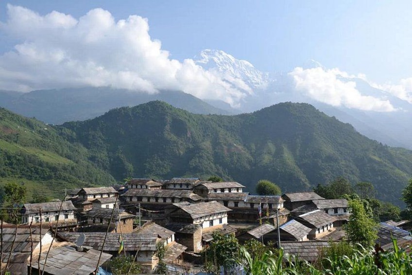 A village with traditional houses nestled in a mountainous area. 2