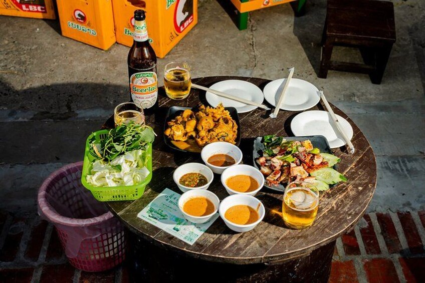 A local favorite: grilled beef, sesame dipping sauces, and an icy Beerlao on a balmy Laos evening 1